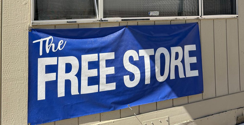 The Free Store blue banner on the building exterior